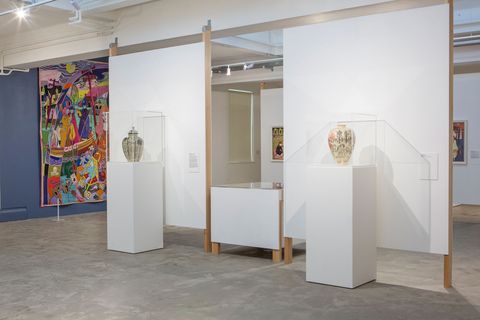 Gallery with modular partitions, custom plinths and display cases.
