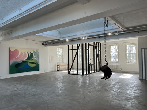 Large gallery space with painting and sculptural installation.