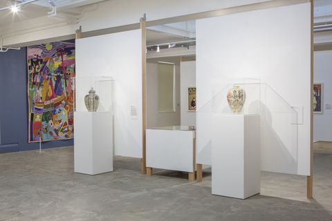 Gallery with modular partitions, custom plinths and display cases.